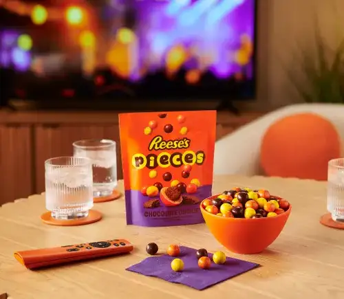Reese's Pieces candy in a bowl alongside a new cookie-textured format product