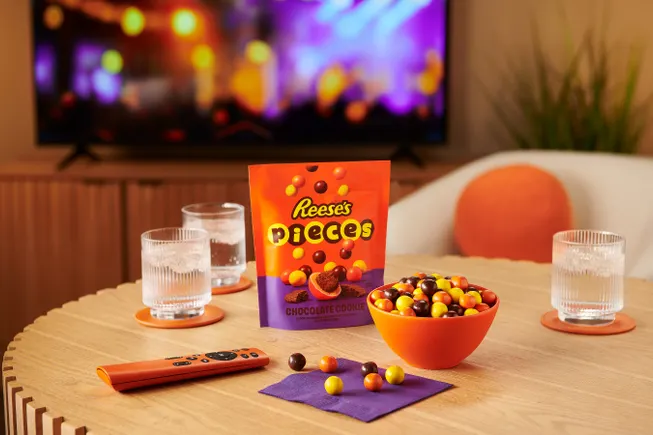 Reese's Pieces candy in a bowl alongside a new cookie-textured format product