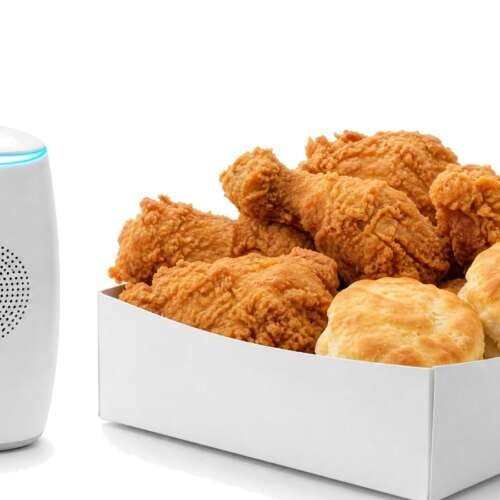 A box of fried chicken and biscuits beside a white drive-thru order speaker with a blue light ring, with the Bojangles logo