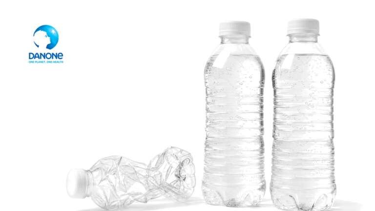 Two full clear unlabeled water bottles and one crushed empty bottle on white, with the Danone logo