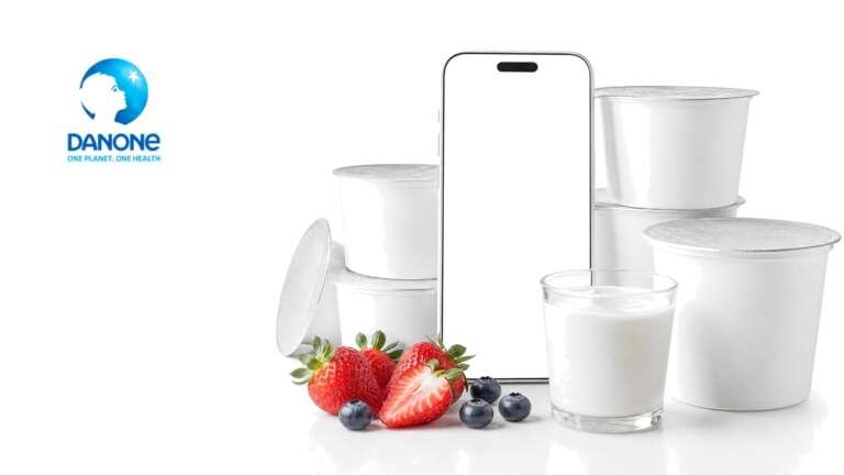 Danone yogurt cups including Oikos and Activia arranged on a bright pure white studio background