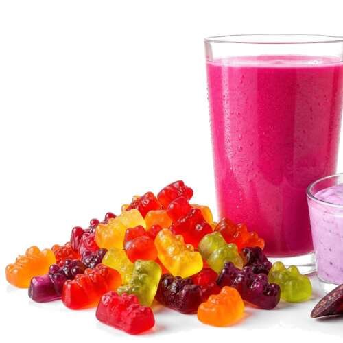 A pink fruit drink, colorful gummy candies and lavender yogurt with a purple carrot and blueberries, with the EXBERRY logo